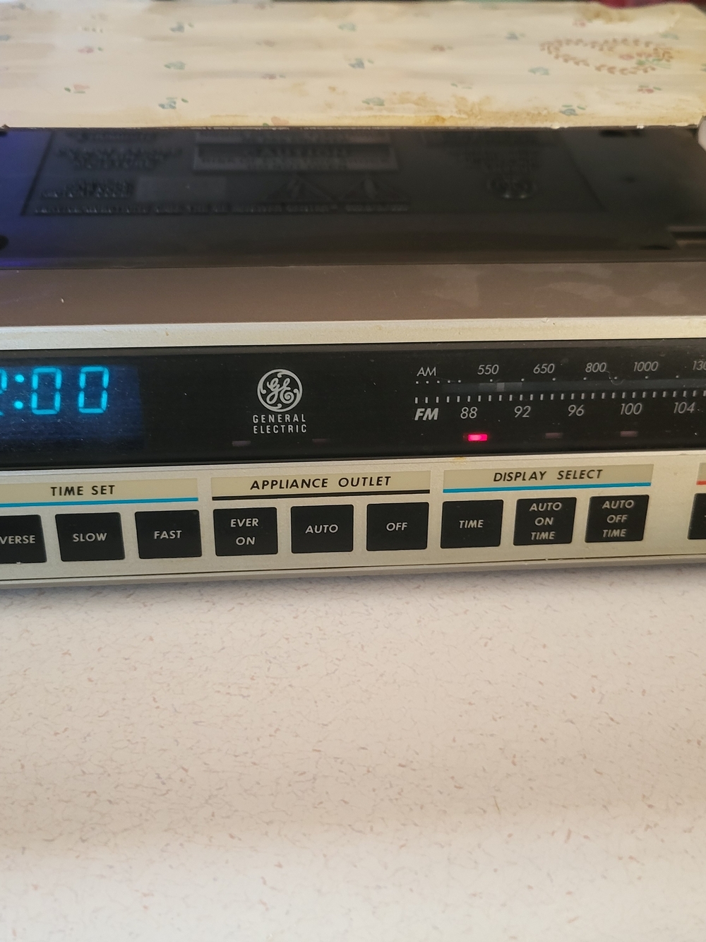 General Electric Black and Cream AM/FM Clock Radio with Appliance Outlet